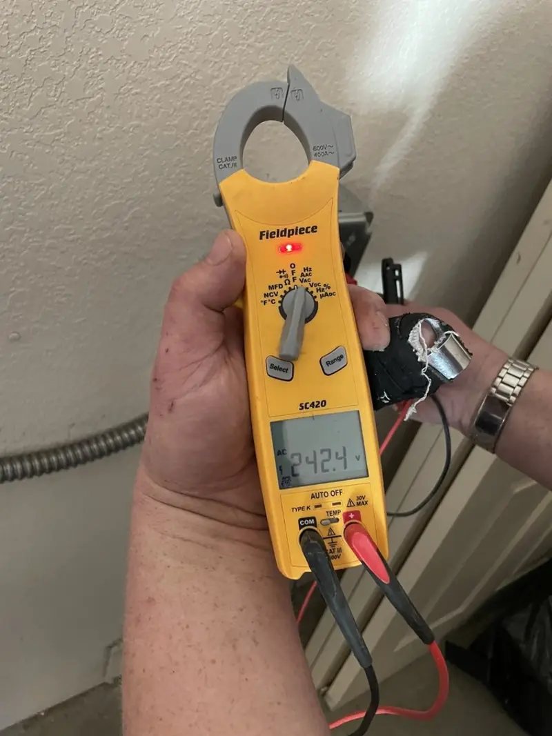 Voltage testing with clamp meter during Ceiling Fan Installation in Kent